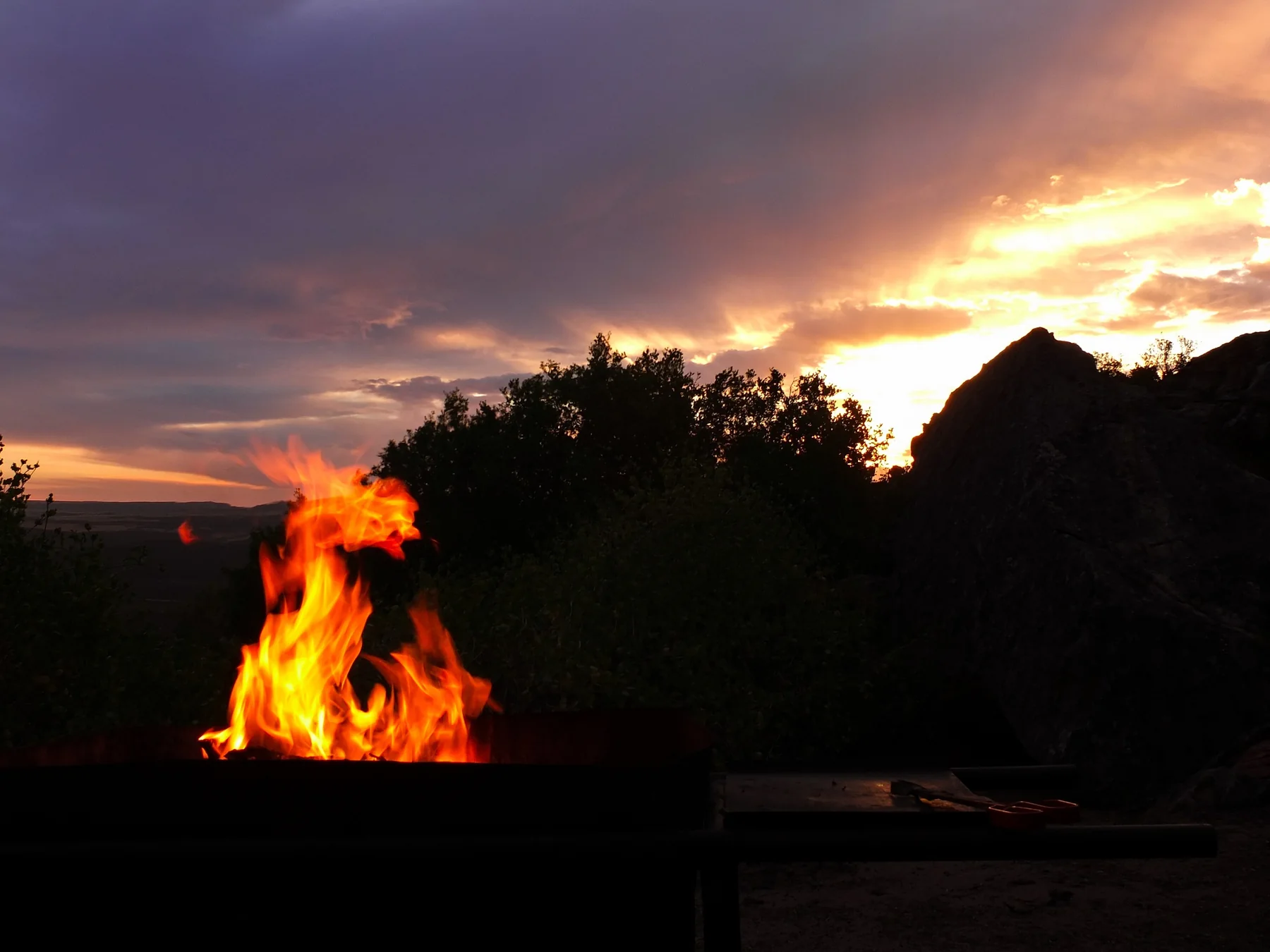 Braai fire beneath a dramatic Cederberg sunset